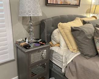 Bedside table, lamps, queen bed