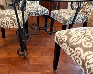 Glass dining table with metal base