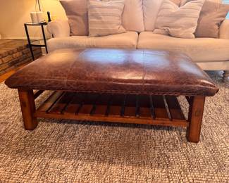 Pottery Barn Leather cushioned ottoman 9 years old. Approx measurements: 48 x 28 x17 1/2 h