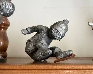 titled "Boy Ice Skating" and was designed by artist Walli Ortman for Hudson Pewter.