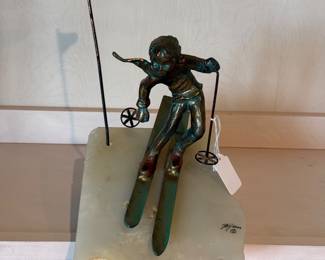 Bijan brass skier on onyx stone base