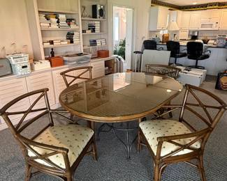 Vintage bamboo rattan dining set with 64" x 44" oval, 3pc glass top, 4 chairs with X back design and palm-print cushion