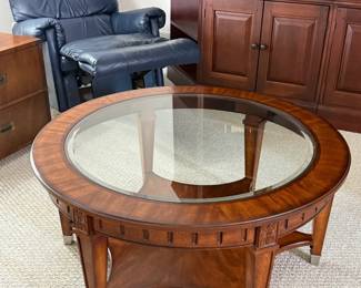 Thomasville 40" round beveled glass cocktail table with stainless leg caps