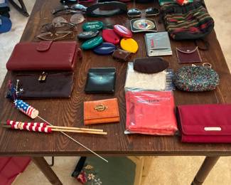 Wallets, coin purses glass cases and glasses