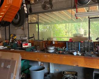 Lots of tools, car ramps, hub caps
