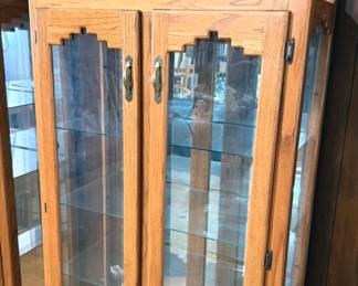 Southwest-style oak + glass curio cabinets with lights