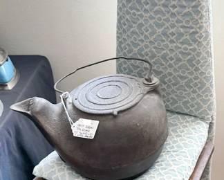 Antique ironing board/chair and cast iron kettle
