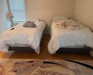 One bed has the head rest and foot rest part that moves up and down these are king xl twins