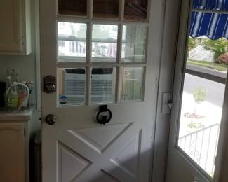 Entry door with electronic lock - note owner keeping door knocker