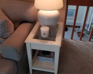 Glass top end table matches coffee table; table lamp (two available)