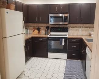 U-shaped kitchen - cabinets perfect for a man cave or she shed!