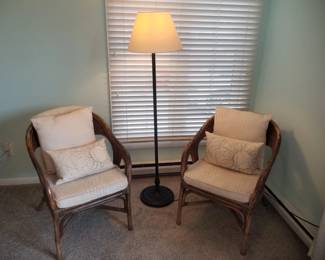Rattan accent chairs; floor lamp