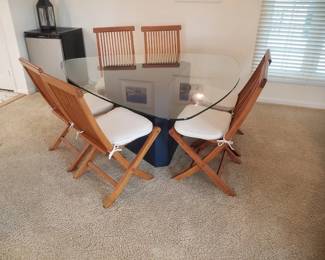 Glass top dining table with navy base