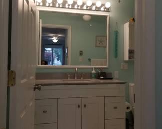 Vanity lights; mirror; updated bath vanity. Lighted ceiling fan