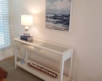 Glass top foyer table; table lamp; artwork