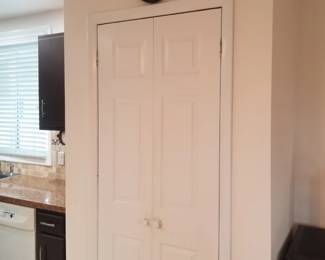 6-panel closet doors; wall clock