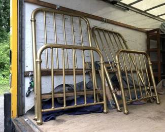 Vintage (1910s) brass beds with frames.