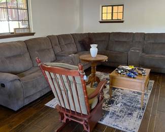 In need of a larger sofa?  Consider this sectional.  I see a couple of cup holders and the possibility of a recliner on either end.  Don't forget the rocking chair, tables, and area rug.