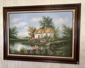 There are a few framed art pieces in the sale, including this one of a thatched-roof cottage.