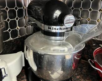 While the background makes seeing this black KitchenAid stand mixer trickier to see, it is worth the effort.