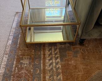 $400 pair of brass and glass end tables. The tables measure 20”w X 24”d X 22” h.