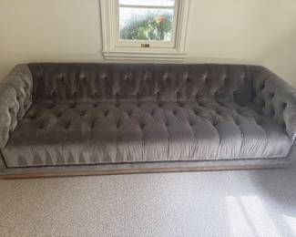$1200 gray velvet tufted sofa. 95”w X 34”w X 26”h. (orig 2,300)