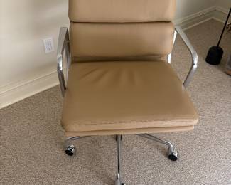 $1,400 Eames tan, leather and aluminum swivel desk chair. 21”w X 21”d X 34”h.