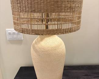 $280 pair of ceramic based lamps with rattan shades. 31"h X 16.5" dia. shade. (orig. $580 pr)