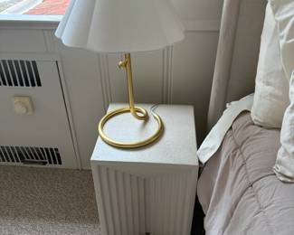 Another view of the bedside tables and brass based Visual Comfort table lamp.