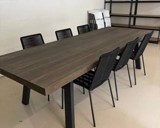 Article "Sardis" vintage large outdoor dining table. 118 inches wide by 43 inches deep by 31 inches high. Six metal corded chairs. Each chair is 18 inches wide by 23 inches deep by 35 inches high. Chairs made by Article and more can be purchased online.