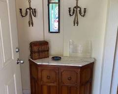 entry marble topped furniture and mirror, decorative scones