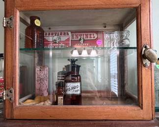 Vintage Wooden Apothecary Display Cabinet with Sentinel First Aid Items