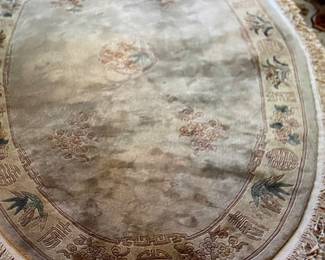 eutral Oval Rug with Fringe. Purchased in Hong Kong.
