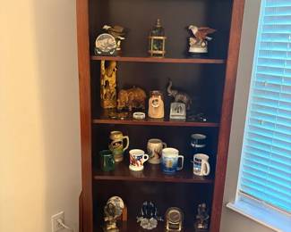 Bookcase With Mugs, Books And Other Items