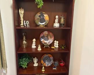 Bookcase With Decorative Plates And Other Collectibles