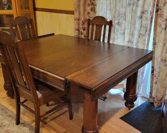 Gorgeous oak table with self storing leaves.  Check out those legs!