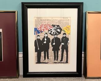 Framed prints featuring a pin-up girl, the Beatles, and an Irving Berlin Broadway sheet music cover