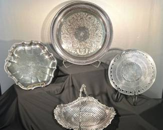 Silver plated trays, a Victorian style basket with swing hand and a reticulated serving plate