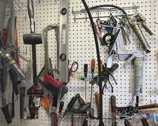 Assorted Hand Tools on Pegboard Wall