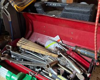 Assorted Hand Tools on Pegboard Wall