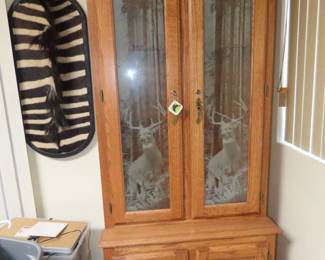 Wooden gun storage cabinet.