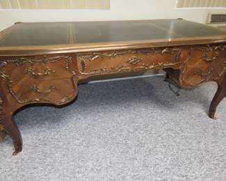 French desk with ornate gilt decorations. 