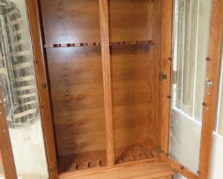 Wooden gun storage cabinet.