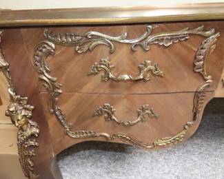 French desk with ornate gilt decorations. 