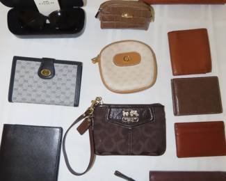 Selection of Coach, Gucci and other wallets.