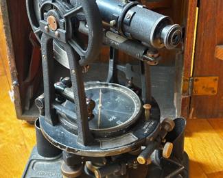 antique Keuffel & Esser surveyor's transit in its original wooden carrying case