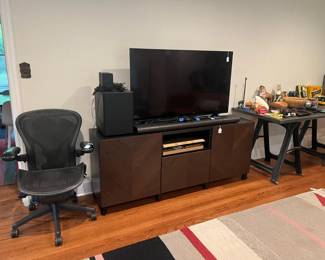 New tv, sound equipment, Aeron chair by Herman Miller