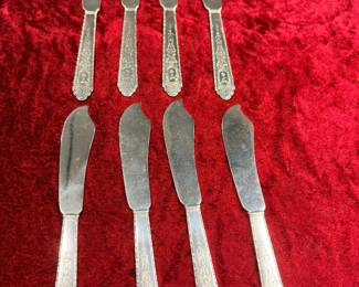 Set of eight Sterling butter knives