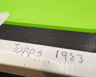 Baseball cards in box labeled TOPPS 1983