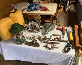 Coleman lanterns, hand plane, bike seat, circular saw, braces, shop lamp, vintage planer, pipe bender, etc.